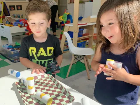 a couple of children playing with toys