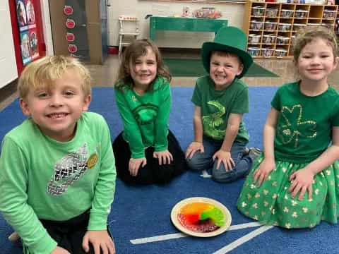 a group of children sitting on the floor