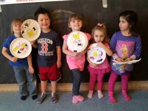 a group of children holding signs