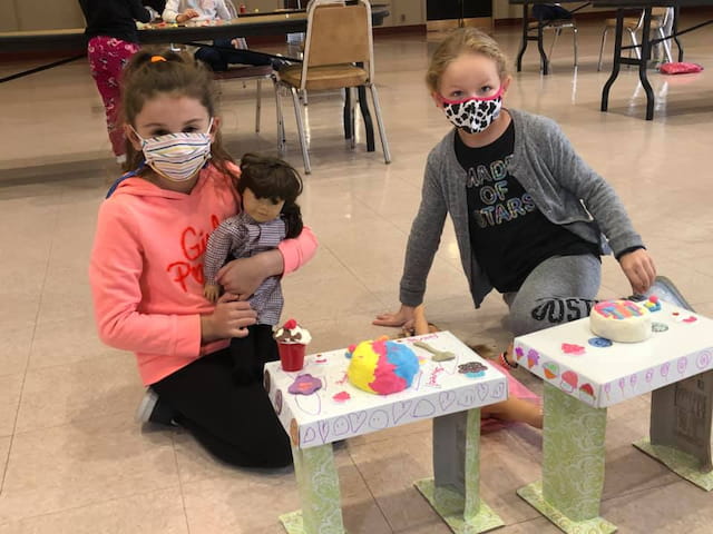 a group of children wearing masks