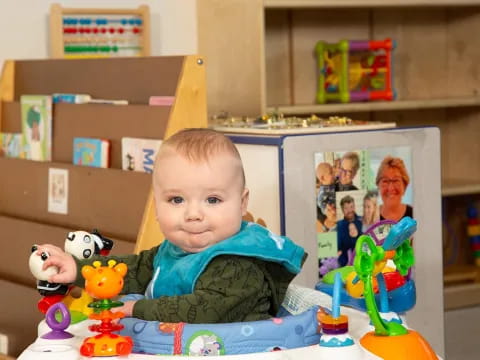 a baby sitting at a table