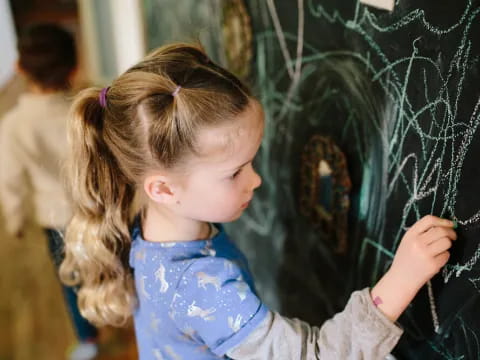 a young girl painting