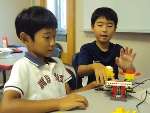 a couple of boys playing with toys