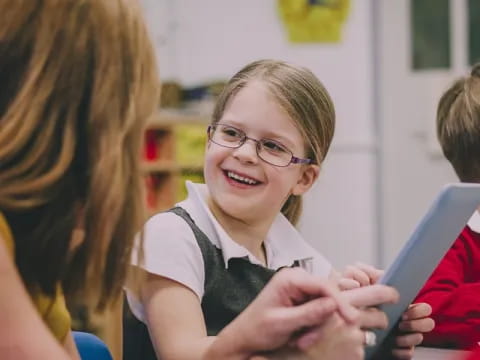 a young girl smiling