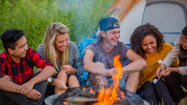 a group of people around a campfire