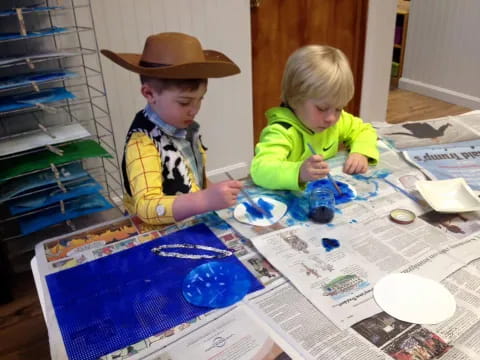 a couple of children playing with a toy