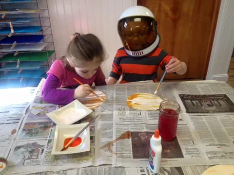 a couple of kids painting