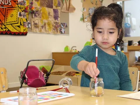 a child sitting at a table