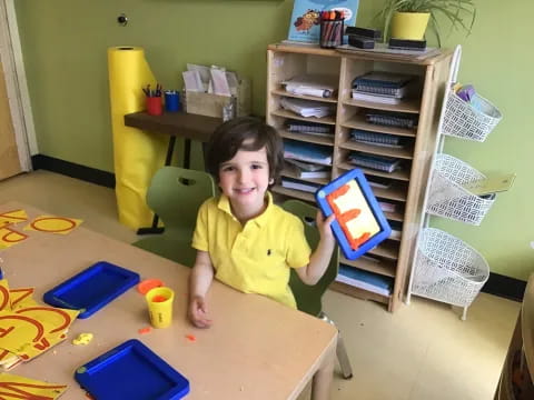 a child sitting at a table