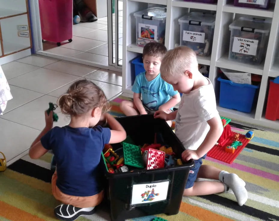 a group of kids playing with toys