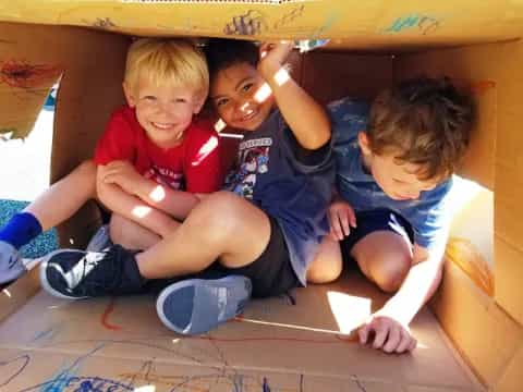 a group of boys lying on the floor