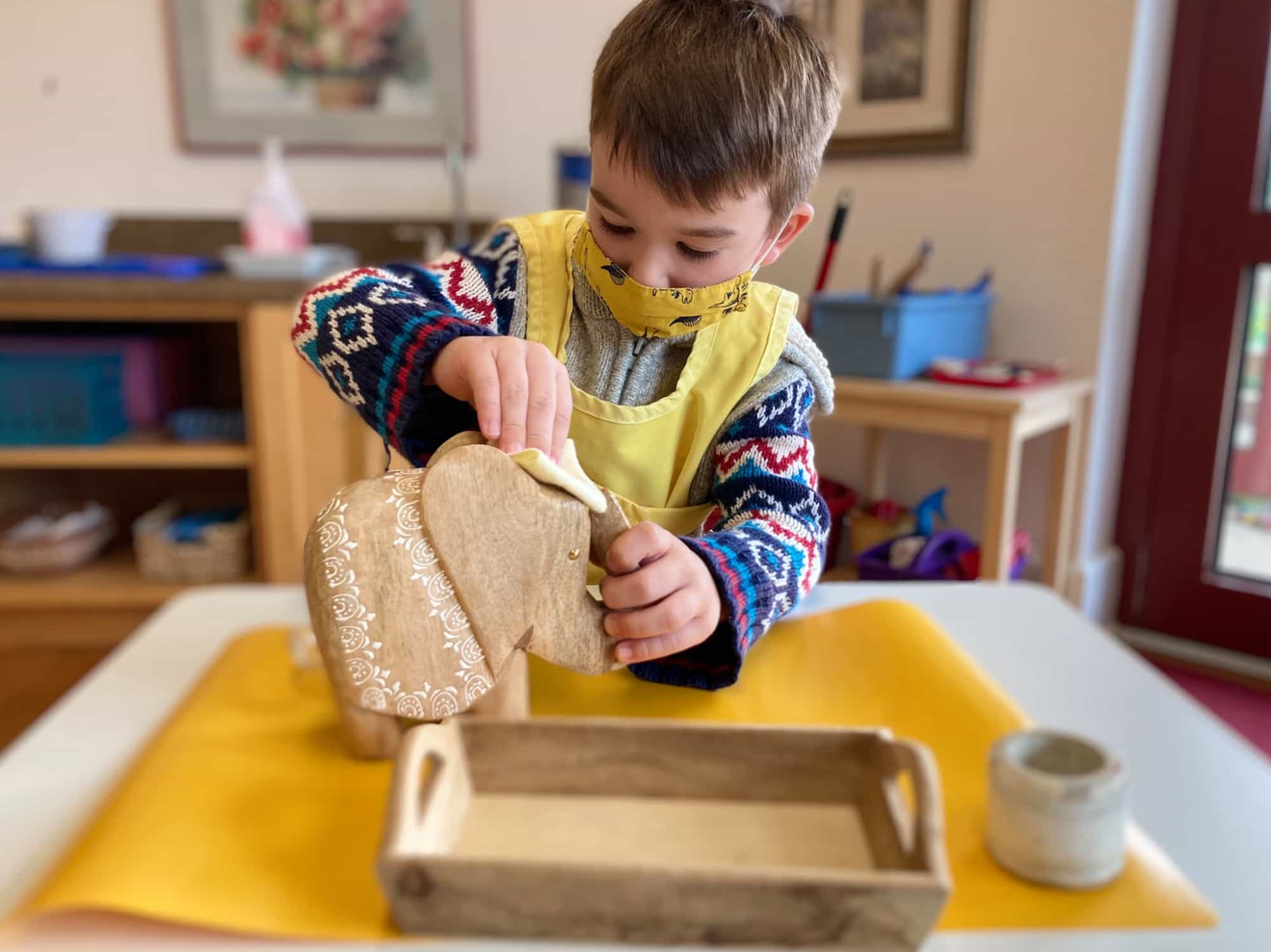 a child painting on a table