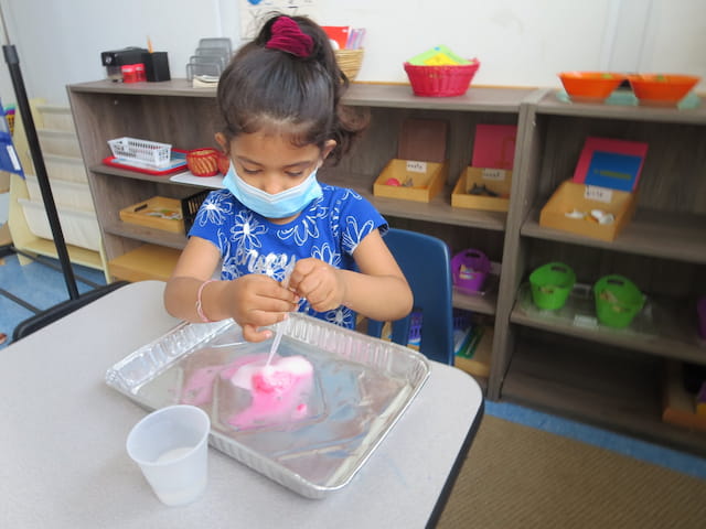 a young girl painting