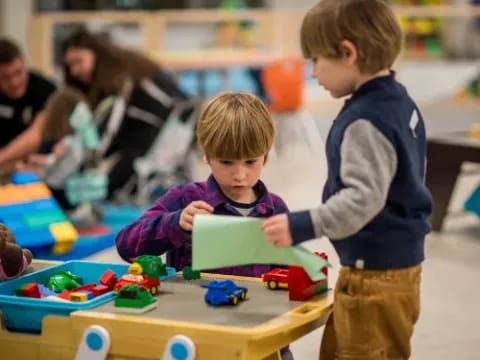 a couple of children playing with toys