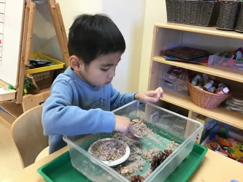 a child making food in a container