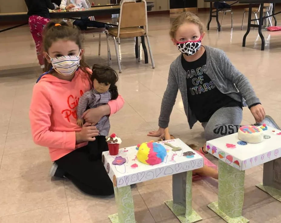 a group of children wearing masks