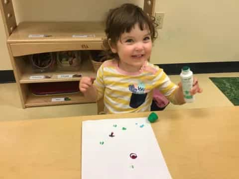 a child sitting at a table