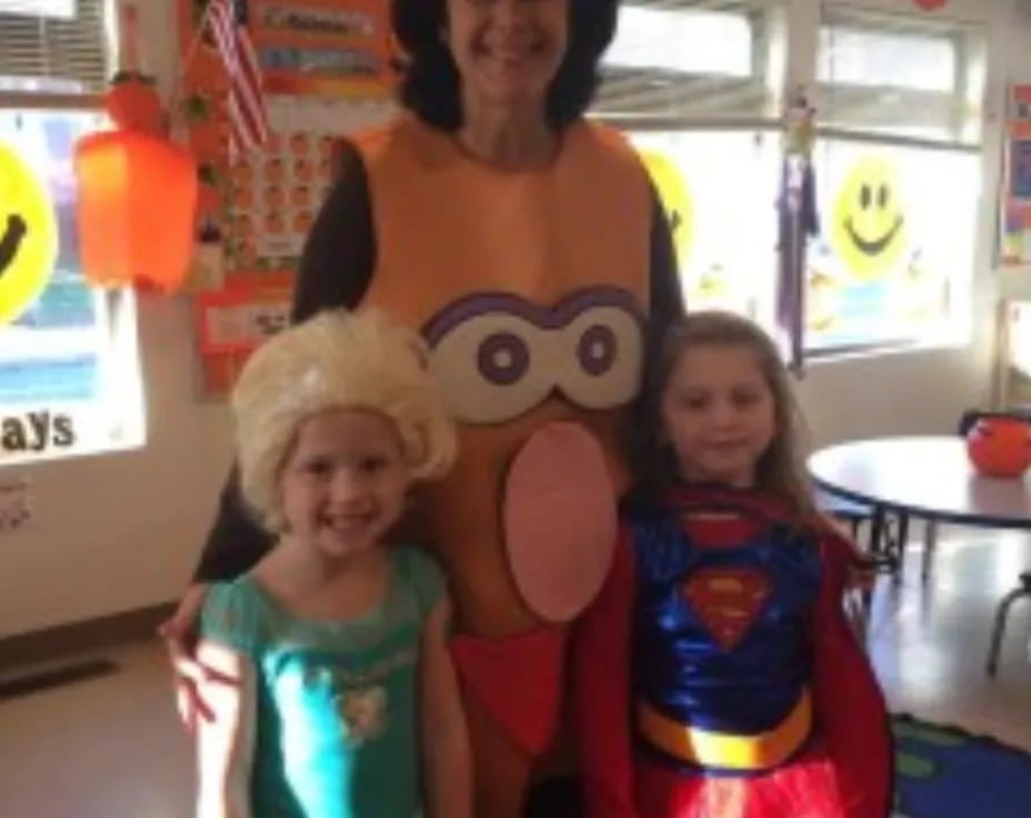 a person and two girls wearing clothing