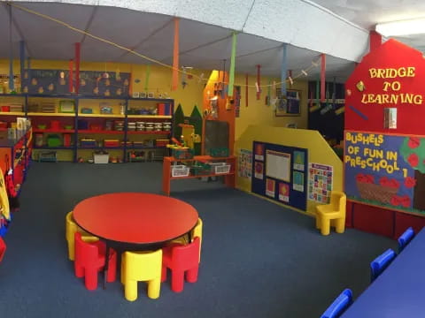 a room with colorful chairs and tables