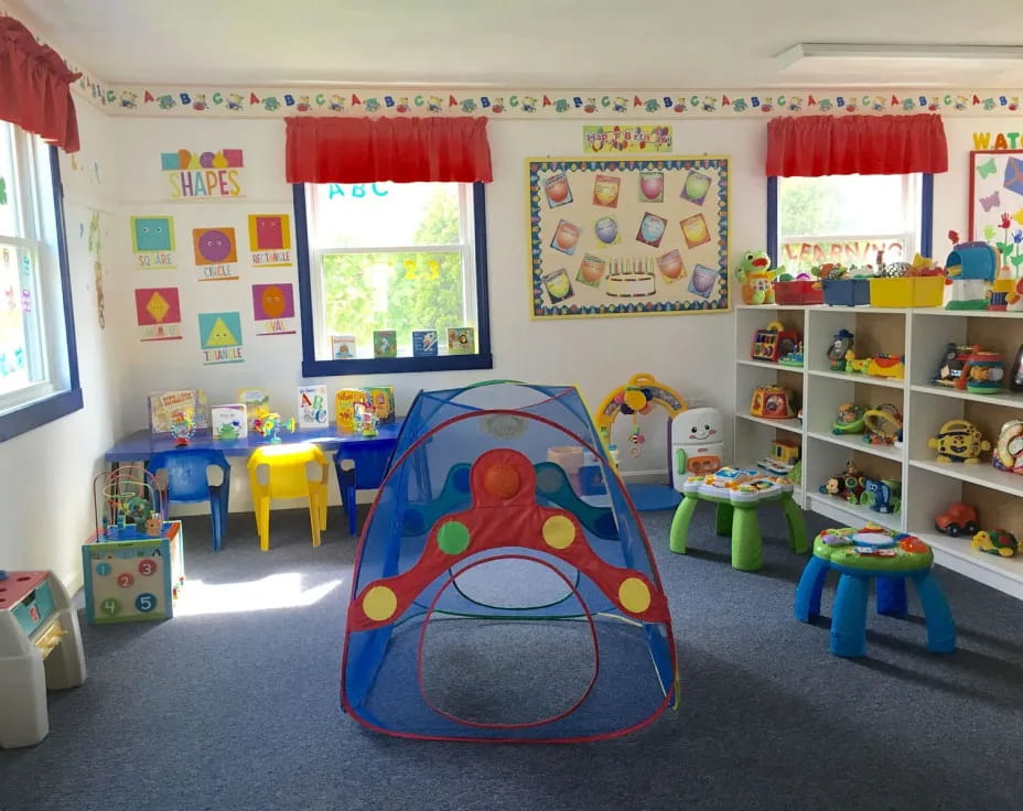 a room with colorful chairs and toys