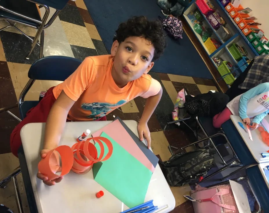 a boy sitting at a table