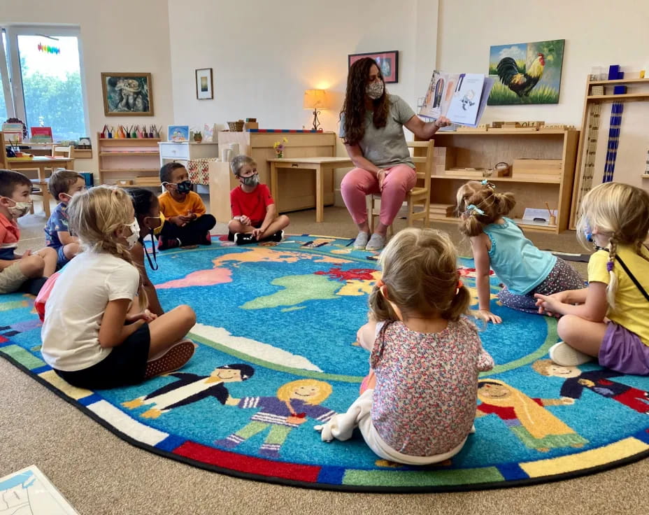 a group of children sitting on the floor