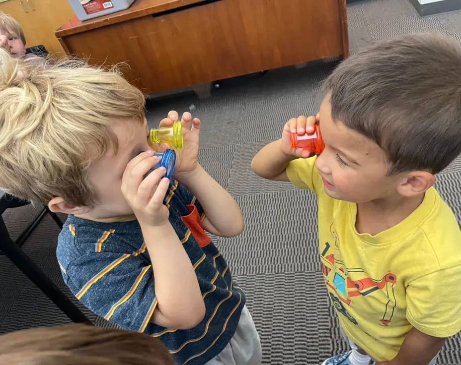 a couple of kids playing with toys