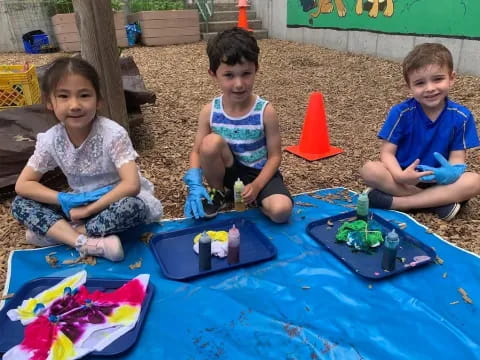 a group of children playing with toys