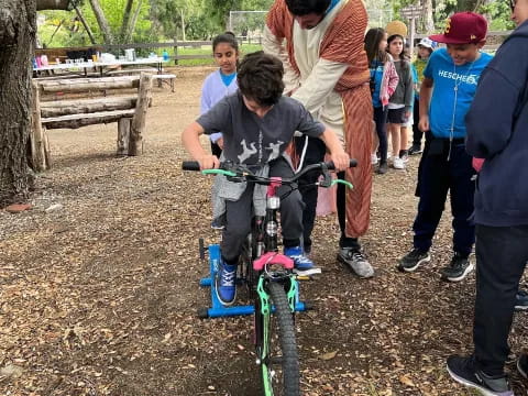 a group of people around a bicycle