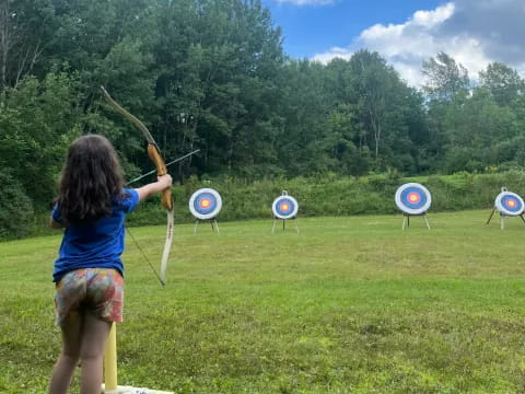 a girl playing target archery