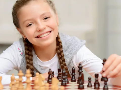 a girl playing chess