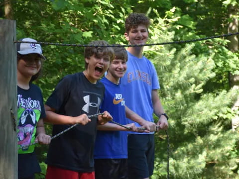 a group of boys holding a fish
