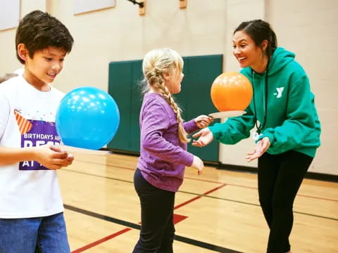 a group of people holding balloons