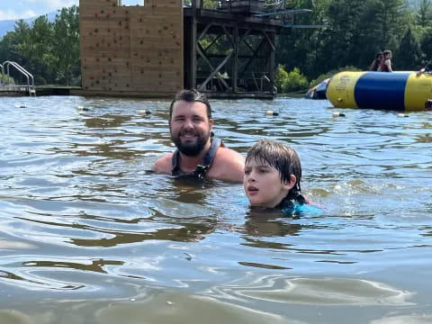 a person and a boy in the water