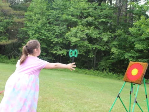 a girl throwing a frisbee