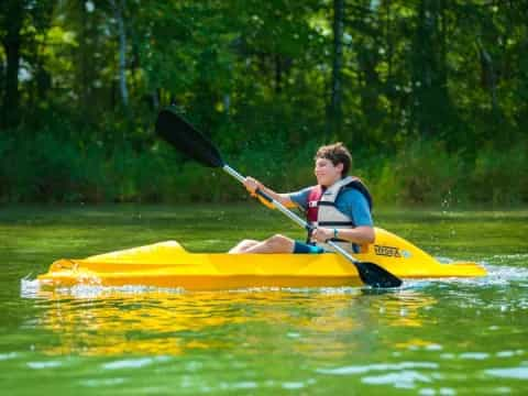 a boy in a kayak