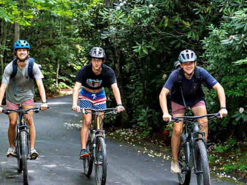 a group of people riding bikes