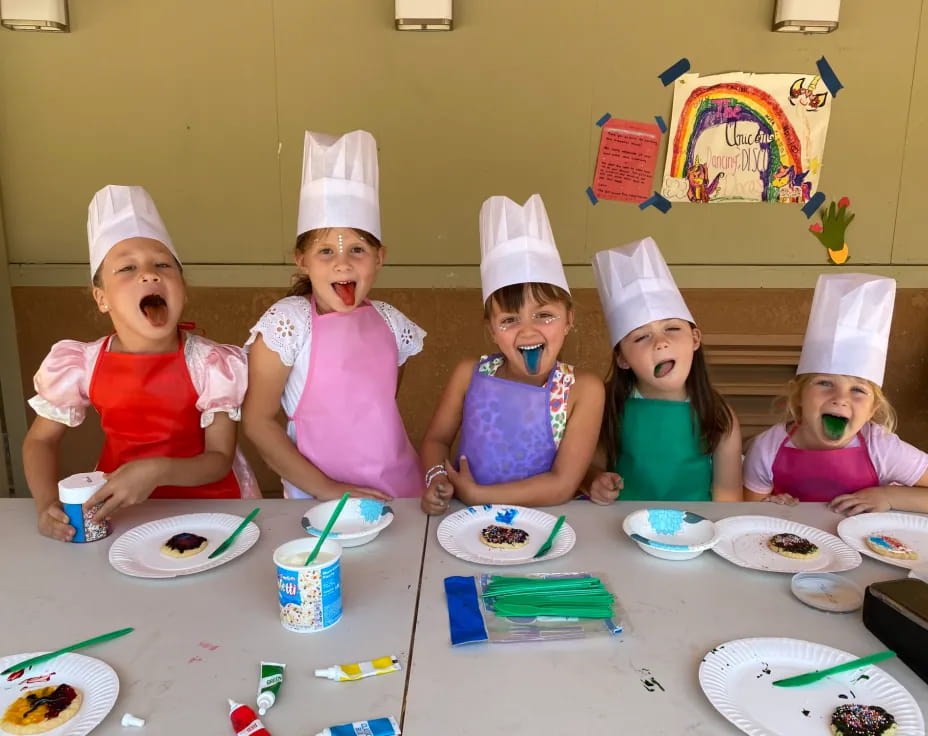 a group of kids wearing party hats