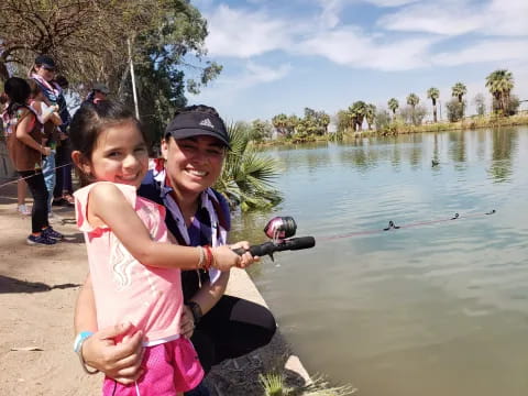 a person and a girl fishing