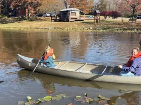 a couple of people in a boat on a river