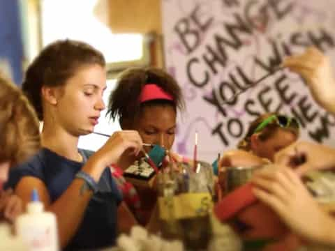 a group of people sitting at a table with drinks