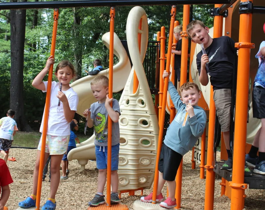 a group of kids playing on a playground