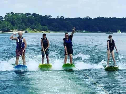 a group of people on surfboards