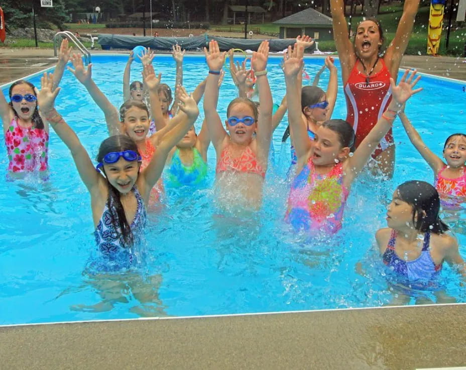 a group of children in a pool