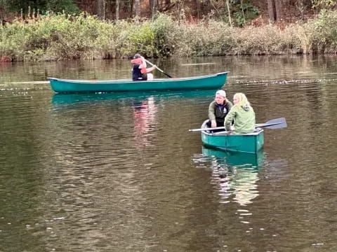 a group of people in a canoe on a river