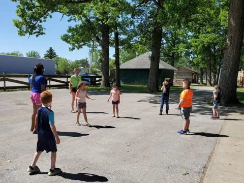 a group of kids playing in a park