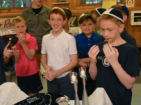 a group of kids posing for a picture