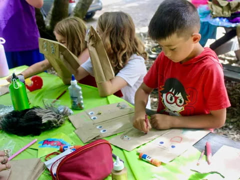 children painting on a table