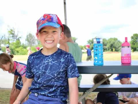 a boy sitting on a bench