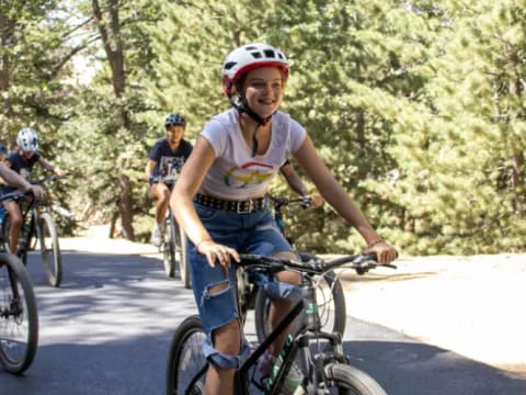 a group of people riding bikes